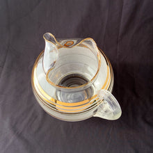 Load image into Gallery viewer, Overhead close-up of gold banded stripes on white sugar texture frosted glass pitcher