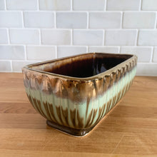 Load image into Gallery viewer, Stunning rectangular ceramic pottery planter with a striking vertical leaf motif finished with a coppery gold and turquoise and brown drip glaze with deep brown interior. Crafted by Lefton, Japan, circa 1950s. In excellent condition, free from chips/cracks/repairs. Marked "ESD JAPAN, HAND PAINTED. JA7129". Measures 9 x 4 1/2 x 4 1/2 inches