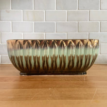 Load image into Gallery viewer, Stunning rectangular ceramic pottery planter with a striking vertical leaf motif finished with a coppery gold and turquoise and brown drip glaze with deep brown interior. Crafted by Lefton, Japan, circa 1950s. In excellent condition, free from chips/cracks/repairs. Marked "ESD JAPAN, HAND PAINTED. JA7129". Measures 9 x 4 1/2 x 4 1/2 inches