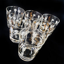 Load image into Gallery viewer, Vintage mid-century era old fashioned cocktail glass featuring gold and white skeleton keys. We scored these fabulous Hollywood Regency style glasses in a rec room bar of an estate sale...cheers! In excellent condition, no chips/wear. Unmarked. Measures 3 x 3 1/4 inches Capacity 8 ounces