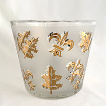 Load image into Gallery viewer, Vintage mid-century Golden Foliage and Fleurs-de-lis flared glass ice bucket, features gold leaves and fleurs-de-lis on frosted panels. Crafted by Libbey Glass, USA, 1950s. This piece holds a good amount of ice cubes to help keep your cocktails cold. Your bar cart has never looked better!
In excellent vintage condition, no chips/wear.
Measures 5 5/8 x 4 3/4 inches