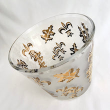 Load image into Gallery viewer, Vintage mid-century Golden Foliage and Fleurs-de-lis flared glass ice bucket, features gold leaves and fleurs-de-lis on frosted panels. Crafted by Libbey Glass, USA, 1950s. This piece holds a good amount of ice cubes to help keep your cocktails cold. Your bar cart has never looked better!
In excellent vintage condition, no chips/wear.
Measures 5 5/8 x 4 3/4 inches