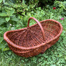 Load image into Gallery viewer, Vintage handmade natural grapevine handled basket. Made in Poland. A beautiful basket for fruit or flower picking. Lends itself nicely to farmhouse, cottage and shabby chic decor. In excellent condition with original sticker. Measures 18 3/4 x 11 x 11