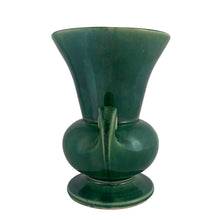 Load image into Gallery viewer, Vintage mid-century gloss green trumpet vase with curled handles. Crafted by McCoy Pottery, late 1950s. This lovely vase is must for any art pottery collector!
In excellent condition, no chips/cracks/repairs, crazing commensurate with age, typical manufacturing glaze pops. Maker's mark on the bottom.
Measures 6 1/4 x 5 7/8 x 8 inches