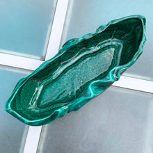 Load image into Gallery viewer, This large vintage ceramic planter features a sculpted wave pattern glazed in deep green drip glaze. Marked "Made in Canada" with the shape number C217. It's the perfect vessel to showcase your favourite houseplants or succulents. In great vintage condition with one minor flea bite on the rim, otherwise no issues. Measures 15 x 6 x 3 1/4 inches