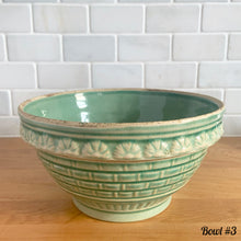 Load image into Gallery viewer, Antique green glazed stoneware 2 quart mixing bowl featuring a basketweave and fan pattern. Crafted by Robinson Ransbottom, USA, 1920s. A well-crafted piece of vintage stoneware offering a nostalgic vibe to your farmhouse or cottage kitchenware and decor!
Bowl #1 is in as found vintage condition, no chips/cracks/repairs, age-related crazing and glaze pops. Crown 8 mark.
Measure 8 1/4 x 4 3/8 inches