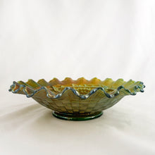 Load image into Gallery viewer, Antique Grape and Cable iridescent green carnival glass bowl featuring a basketweave pattern on the exterior, a smooth sawtooth ruffled pie crust edge and collar base. Crafted by Northwood Glass Company, USA, early 1900s. A lovely vintage piece to display or use as a candy dish!
In excellent condition, no chips. Marked on the bottom with Northwood N with underline inside a circle.
Measures 8 3/8 x 2 1/4 inches