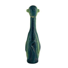 Load image into Gallery viewer, Rare vintage art deco figural smiling and wide eyed seated monkey ceramic long neck flask or decanter, glazed in green and navy blue. Crafted by Schafer and Vater, Germany, circa 1930s. This decanter is reminiscent of a Dr. Seuss-like character, and would be a statement piece for any barware collection! In excellent condition. Crazing present. Measures 2 1/2 x 3 x 10 inches tall