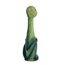 Load image into Gallery viewer, Rare vintage art deco figural smiling and wide eyed seated monkey ceramic long neck flask or decanter, glazed in green and navy blue. Crafted by Schafer and Vater, Germany, circa 1930s. This decanter is reminiscent of a Dr. Seuss-like character, and would be a statement piece for any barware collection! In excellent condition. Crazing present. Measures 2 1/2 x 3 x 10 inches tall