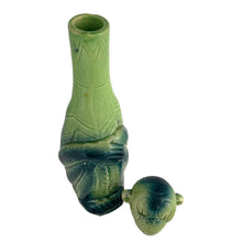 Load image into Gallery viewer, Rare vintage art deco figural smiling and wide eyed seated monkey ceramic long neck flask or decanter, glazed in green and navy blue. Crafted by Schafer and Vater, Germany, circa 1930s. This decanter is reminiscent of a Dr. Seuss-like character, and would be a statement piece for any barware collection! In excellent condition. Crazing present. Measures 2 1/2 x 3 x 10 inches tall