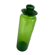 Load image into Gallery viewer, Striking vintage green hand blown art glass apothecary jar with ground lid. The finial on the lid features a flower design. Produced by Takahashi Glass, Japan, circa 1970. Perfect for food storage, or home decor. This fabulously happy colour will liven up any room, especially in a bright window! Good vintage condition with minor flea bite on the inside rim of the lid. Typical manufacturing imperfections in the glass such as bubbles and stringers. Measures 3 3/4 x 13 1/2 inches