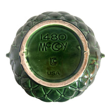 Load image into Gallery viewer, Large vintage TIerra Cushion jardiniere planter pot 1480, deep green shiny glaze, features an overlapping floral leaf pattern around the top rim, a diamond quilted body and ribbon handles. Crafted by McCoy Pottery during the Lancaster Colony Corporation Era, USA, 1974 - 1985. A must-have for any McCoy collector or gardener!
In excellent condition, free from chips, cracks or repairs, with a tiny manufacturer's defect, see photo. Maker's mark is on the bottom. Produced Measures 10 1/4 x 8 3/4 inches