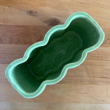 Load image into Gallery viewer, Vintage mid-century two-tone green basketweave art pottery planter. Crafted by McCoy Pottery, USA, circa 1950s. A collectible art pottery planter that is perfect for forcing spring flower bulbs, planting succulent or a floral arrangement.
In excellent condition, no chips/cracks/repairs. Maker's mark.
Measures 5 5/8 x 2 1/2 x 4 1/4 inches