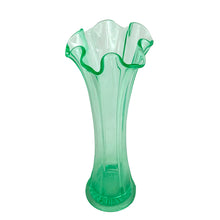 Load image into Gallery viewer, Vintage uranium art glass swung flower vase with a lovely ruffled rim. Crafted by Fenton Art Glass, USA, 1930s. Glows brilliantly when exposed to black light. Perfect for the swung, uranium or Fenton glass collector!
In very good vintage condition, no chips, cracks, or repairs, hard water marks consistent with age.
Measures 3 3/4 x 9 5/8 inches