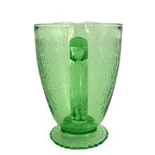 Load image into Gallery viewer, Vintage Florentine 1 green uranium depression era glass 36oz pitcher features a scalloped foot and glows beautifully under black light. Crafted by Hazel-Atlas Glass, USA, 1932 - 1935. Perfect for adding a touch of sophistication to any table setting or display in your uranium glass collection!
In excellent used vintage condition, no chips, minor wear.
Measures 7 x 4 7/8 x 6 3/4 inches (incl. handle/spout)