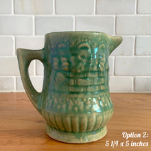 Load image into Gallery viewer, Antique vintage art deco gloss green Rosella 320 ceramic yellow ware pitcher featuring climbing roses on a basketweave pattern. Crafted by Robinson Clay Product Company, the precursor to Robinson Ransbottom Pottery, USA, early 1900s. A beautiful piece to add to your art pottery collection! Option 2, 5 1/4 x 5 inches
In as found vintage condition, no chips/repairs, tiny cracks at the spout, age-related crazing. Typical manufacturing glaze pops. Unmarked.