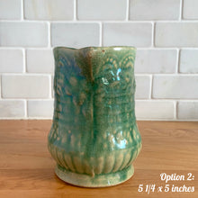 Load image into Gallery viewer, Antique vintage art deco gloss green Rosella 320 ceramic yellow ware pitcher featuring climbing roses on a basketweave pattern. Crafted by Robinson Clay Product Company, the precursor to Robinson Ransbottom Pottery, USA, early 1900s. A beautiful piece to add to your art pottery collection! Option 2, 5 1/4 x 5 inches
In as found vintage condition, no chips/repairs, tiny cracks at the spout, age-related crazing. Typical manufacturing glaze pops. Unmarked.