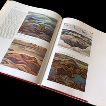 Load image into Gallery viewer, Vintage The Group of Seven hard cover art book. Written by Peter Mellen and published by McClelland and Stewart, Canada, 1971 (third printing). Its 231 pages are filled with the history and images of Canada's most famous group of early 20th century artists who focused on painting the complex and varying landscapes of the country in their unique style. In great vintage condition, minor tear to back of book jacket.