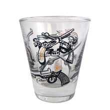 Load image into Gallery viewer, Set of six vintage wild west themed double shot glasses featuring revolvers and pistols in black, white and gold. Crafted by Libbey Glass, circa 1950s. A great addition to your barware collection!
In excellent condition, no chips. Marked on the bottom with the Libbey L.
Measures 2 3/4 x 3 inches
Capacity 2 ounces