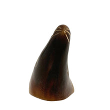 Load image into Gallery viewer, This charming vintage hand-carved sea lion sculpture is crafted from polished buffalo horn, showcasing beautiful natural color variations from deep black to translucent ivory. The minimalist folk art style, smooth contours, and subtle carved details give this piece a warm, tactile character that feels both playful and timeless.
Each angle highlights the artisan’s hand—no two horn carvings are ever exactly alike. A lovely addition to a coastal décor display, folk art collection, or curio shelf.