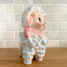 Load image into Gallery viewer, Bring a touch of vintage charm to your space with this anthropomorphic happy lamb planter, featuring soft pastel details, sculpted curls, and delicate floral accents. Crafted by Rubens Originals, Japan, 1950s. This whimsical planter is perfect for adding personality to shelves, windowsills, nurseries or as a baby shower gift.