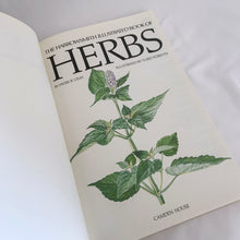 Load image into Gallery viewer, Vintage The Harrowsmith Illustrated Book of Herbs softcover 175-page reference book is jam-packed with detailed information on cultivating and using herbs. Written by Patrick Lima and beautifully illustrated by Turid Forsyth for Camden House, Canada, 1986, fourth printing 1990. A superior reference book for the herb and gardening enthusiast! In excellent vintage condition, minor yellowing to the interior pages.