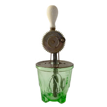 Load image into Gallery viewer, Complete 1920s Hazel-Atlas green uranium depression glass hand beater mixer with original wood-handled beater, American kitchenware, glowing under black light