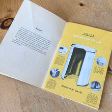 Load image into Gallery viewer, This vintage softcover High School Manual on Commercially Canned Foods is a jam-packed with information about the commercial canning process, food safety and recipes. Its 46 pages are filled reference information, black and white illustrations and photographs. Published by the American Can Company in 1946, Hamilton, Canada. This would have been given to high school students as part of the curriculum.
In good vintage condition with age-related wear, foxing/yellowing of the pages.
Measurements 6 x 9 inches