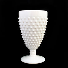 Load image into Gallery viewer, This vintage white milk glass "Hobnail" footed goblet is the epitome of simple elegance! Crafted by Fenton Art Glass, USA, pre 1970. Sip in style with this stunning goblet or repurpose for cotton balls, make-up brushes or in the office to hold pens/pencils. In excellent condition, free from chips or cracks. Unmarked. Measures 3 1/4 x 5 3/4 inches