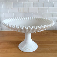 Load image into Gallery viewer, Three-quarter view of Fenton Hobnail milk glass pedestal footed bowl showing crimped rim and hobnail texture