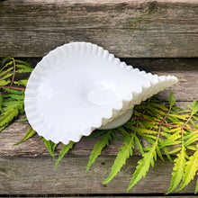 Load image into Gallery viewer, This vintage "Hobnail" pressed milk glass low banana stand brings all the drama! It features a low foot, with folded sides and a crimped edge. Crafted by the Fenton Art Glass, USA, circa 1970s. A graceful piece of pressed glass in a classic pattern that will always be in style no matter your decor style. Fill with your favourite fruits and display! In excellent condition, free form chips/cracks. Measures 12 x 9 x 4 1/2 inches