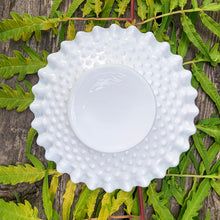 Load image into Gallery viewer, This vintage milk glass "Hobnail" pressed glass 6" bon bon plate brings all the drama! This simple and elegant design features a crimped edge. Use as intended to as an underplate for a condiment dish. Crafted by the Fenton Art Glass, USA, pre-1970s. A graceful piece of pressed glass in a classic pattern that will always be in style no matter your decor style. Fill with your favourite treats! In excellent condition, free from chips/cracks. Measures 5 7/8 inches