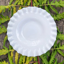 Load image into Gallery viewer, This vintage milk glass "Hobnail" pressed glass 6" bon bon plate brings all the drama! This simple and elegant design features a crimped edge. Use as intended to as an underplate for a condiment dish. Crafted by the Fenton Art Glass, USA, pre-1970s. A graceful piece of pressed glass in a classic pattern that will always be in style no matter your decor style. Fill with your favourite treats! In excellent condition, free from chips/cracks. Measures 5 7/8 inches
