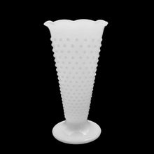 Load image into Gallery viewer, A white milk glass trumpet vase in the "Hobnail" pattern with a lovely scalloped edge. Produced by Anchor Hocking. This is THE quintessential cottage chic vase and it looks beautiful with or without flowers. An excellent choice to add vintage charm to your home, cottage, farmhouse or wedding/bridal decor! In excellent condition, no chips or cracks. Measures 5 x 9 1/2 inches