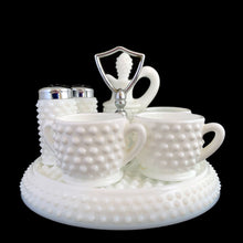 Load image into Gallery viewer, This rare vintage "Hobnail" milk glass condiment set features a round tray with silver-toned handle, salt and pepper shakers, cruet with stopper, creamer, open sugar and jam pot. A classic piece of American glass history to add to your collection! In overall excellent condition for a set of this age. Absent from this set are the lid and spoon for the jam pot. The lid on one of the shakers has damage in one spot where the chrome finish has come away (see photos).
