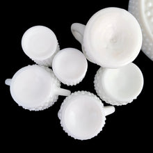 Load image into Gallery viewer, This rare vintage "Hobnail" milk glass condiment set features a round tray with silver-toned handle, salt and pepper shakers, cruet with stopper, creamer, open sugar and jam pot. A classic piece of American glass history to add to your collection! In overall excellent condition for a set of this age. Absent from this set are the lid and spoon for the jam pot. The lid on one of the shakers has damage in one spot where the chrome finish has come away (see photos).