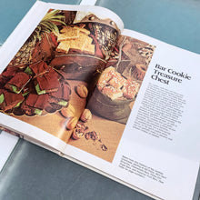 Load image into Gallery viewer, Better Homes and Gardens is known for its fabulous cookbooks. This hardcover cookbook focuses on homemade cookie recipes. Its 96 pages are filled with amazing recipes along with many colour photographs. Originally published by Meredith Corporation, USA, 1975. This is the large format edition, fifth printing, 1984. In great vintage condition with normal age-related yellowing.
