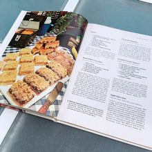 Load image into Gallery viewer, Better Homes and Gardens is known for its fabulous cookbooks. This hardcover cookbook focuses on homemade cookie recipes. Its 96 pages are filled with amazing recipes along with many colour photographs. Originally published by Meredith Corporation, USA, 1975. This is the large format edition, fifth printing, 1984. In great vintage condition with normal age-related yellowing.