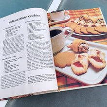 Load image into Gallery viewer, Better Homes and Gardens is known for its fabulous cookbooks. This hardcover cookbook focuses on homemade cookie recipes. Its 96 pages are filled with amazing recipes along with many colour photographs. Originally published by Meredith Corporation, USA, 1975. This is the large format edition, fifth printing, 1984. In great vintage condition with normal age-related yellowing.