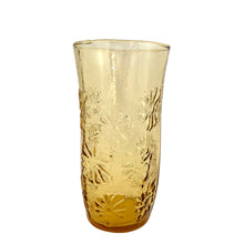 Load image into Gallery viewer, Vintage honey gold "Springsong" cooler glass impressed with daisy flowers on a textured surface. Crafted by Anchor Hocking, USA, circa 1970s. Perfect for a tall cool glass of your favourite beverage or repurpose as a vase, paint brush holder. In excellent condition, free form chips. Measures 3 1/2 x 7 inches
