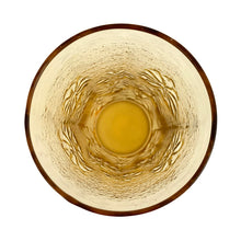 Load image into Gallery viewer, Vintage honey gold "Springsong" cooler glass impressed with daisy flowers on a textured surface. Crafted by Anchor Hocking, USA, circa 1970s. Perfect for a tall cool glass of your favourite beverage or repurpose as a vase, paint brush holder. In excellent condition, free form chips. Measures 3 1/2 x 7 inches