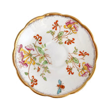 Load image into Gallery viewer, Vintage bone china Avon shaped "Honeysuckles" teacup and saucer. Each piece has a lovely scalloped edge featuring a hand painted Honeysuckle vines and bees in shades of orange, pink, yellow, blue and green, trimmed with gold gilt. Crafted by Royal Albert, England, circa 1927 to 1935. Makes a beautiful gift or addition to your collection!