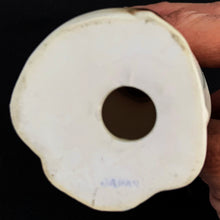 Load image into Gallery viewer, Show off the playful charm of this adorably freckle faced ceramic hound dog figurine! Its wide-eyed expression and pink tongue will add a dash of fun to any room. This beige, tan and black canine features a classic blue bow tie and is sure to charm everyone who sees it! In excellent condition, free form chips/cracks/repairs. Marked "Japan" on the bottom. Measures 2 x 4 1/2 inches