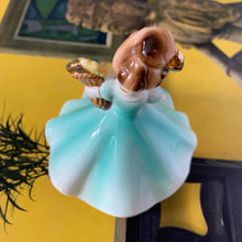 Load image into Gallery viewer, This sweet vintage mid-century figurine is one of the Birthday of the Month series designed by Josef Originals of Japan, circa 1950s. This sweet girl is beautifully styled wearing a full length dress hand painted in aqua and gold, holding a basket of yellow flowers with an aquamarine birthstone in the centre of each flower. In excellent condition, free from chips/cracks/repairs. Marked on the bottom "Josef Originals © Japan" Measures 3 1/2 x 4 inches