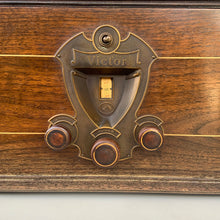 Load image into Gallery viewer, Front close-up of Victor faceplate showing tuning scale and knobs labelled station selector, tuner and volume