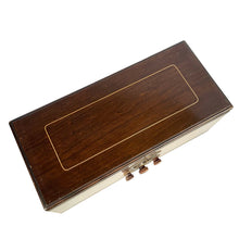 Load image into Gallery viewer, Top view of closed mahogany radio cabinet showing rectangular gold border and surface scratches