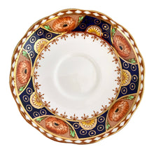 Load image into Gallery viewer, Vintage bone china Avon shaped Imari-style teacup and saucer, "Un-Named Set #562". Each piece has a lovely scalloped edge featuring hand painted cobalt blue panels inset with orange poppy and yellow daisy flowers, topped by a band of white diamonds, trimmed with gold gilt. Crafted by Royal Albert, England, 1930s. Makes a beautiful gift or addition to your collection!