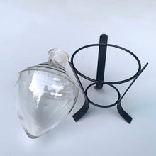 Load image into Gallery viewer, Vintage chemistry inverted beehive beaker and metal stand. Crafted by Owens, USA, 1950s. Salvaged from the estate of the former Dale Pharmacy on Queen St. East in Toronto Canada. This decorative piece of pharmaceutical history would make a unique bud vase! In excellent condition, no chips. Overall measures 3 5/8 x 7 1/8 inches