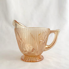 Load image into Gallery viewer, Vintage Iris iridescent flora gold glass creamer and lidded sugar. Crafted by Jeannette Glass, USA, 1960s. The beautifully detailed glassware makes a lovely addition to any tablescape!
In excellent condition, no chips.
Creamer measures 3 1/2 x 3 (not including spout/handle)
Sugar measures 3 3/4 x 5 1/2 inches (not including handles)