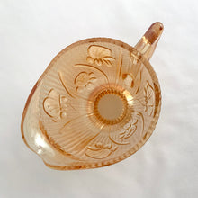 Load image into Gallery viewer, Vintage Iris iridescent flora gold glass creamer and lidded sugar. Crafted by Jeannette Glass, USA, 1960s. The beautifully detailed glassware makes a lovely addition to any tablescape!
In excellent condition, no chips.
Creamer measures 3 1/2 x 3 (not including spout/handle)
Sugar measures 3 3/4 x 5 1/2 inches (not including handles)